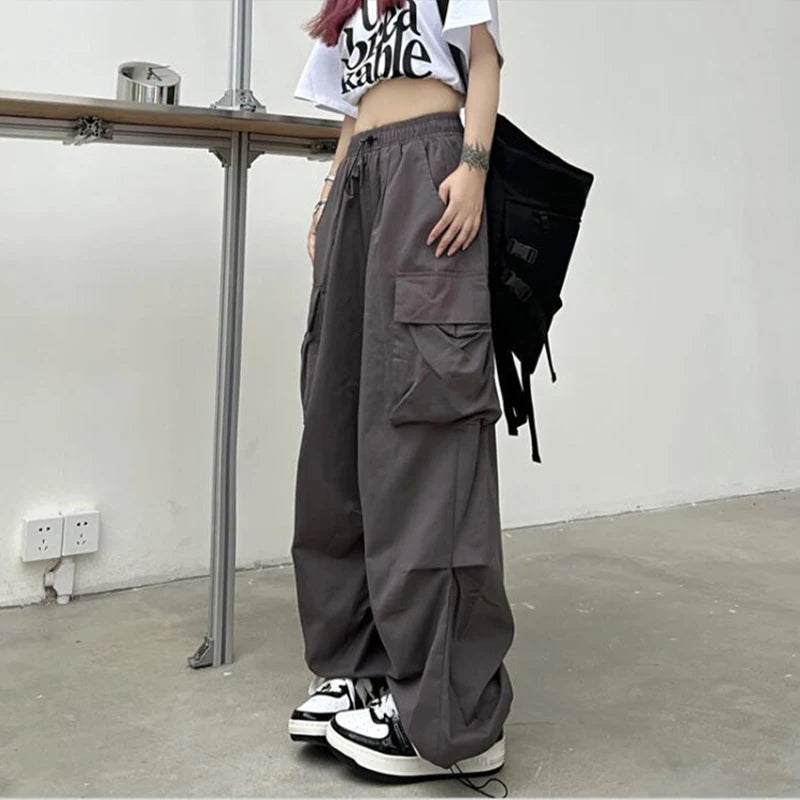 Loose wide trousers with elastic bands and pockets