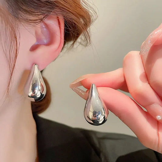 Earrings in the shape of drops, hearts and beans