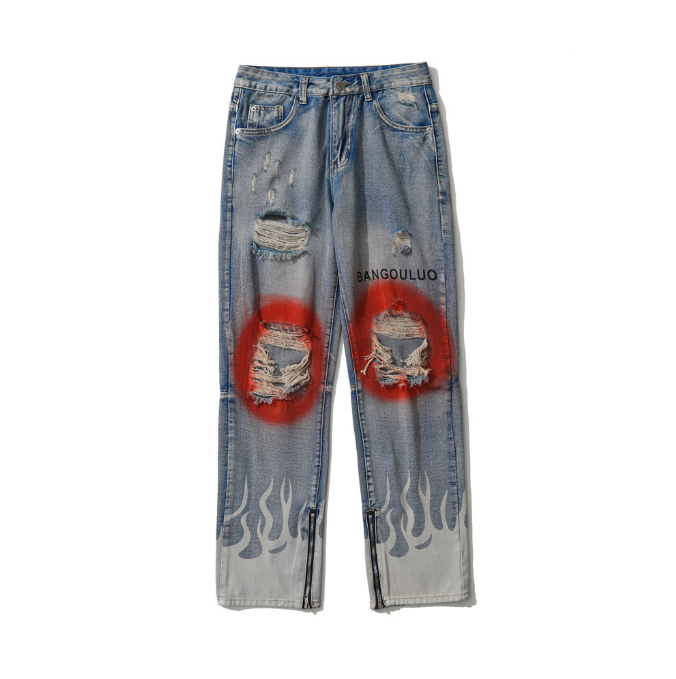 Ripped jeans with a flame and paint motif