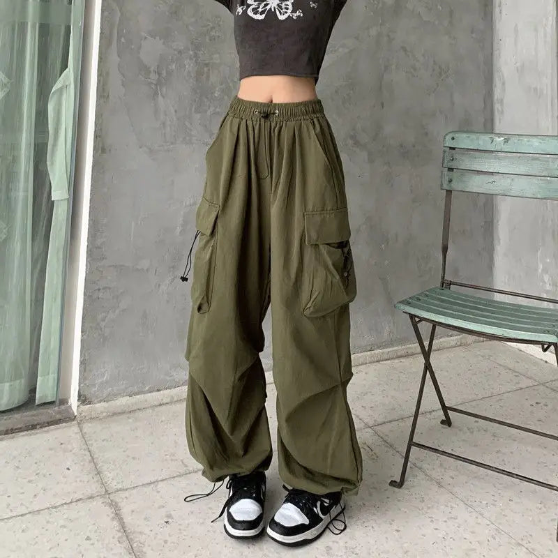 Loose wide trousers with elastic bands and pockets