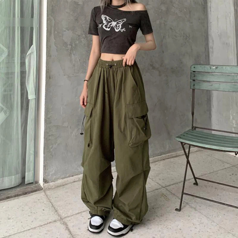 Loose wide trousers with elastic bands and pockets