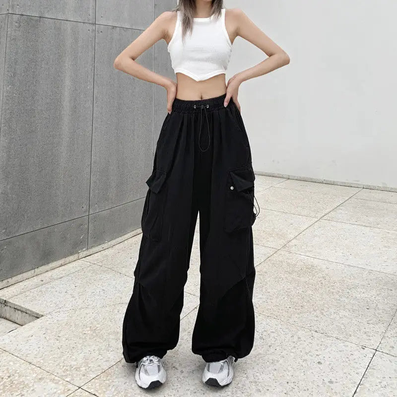 Loose wide trousers with elastic bands and pockets